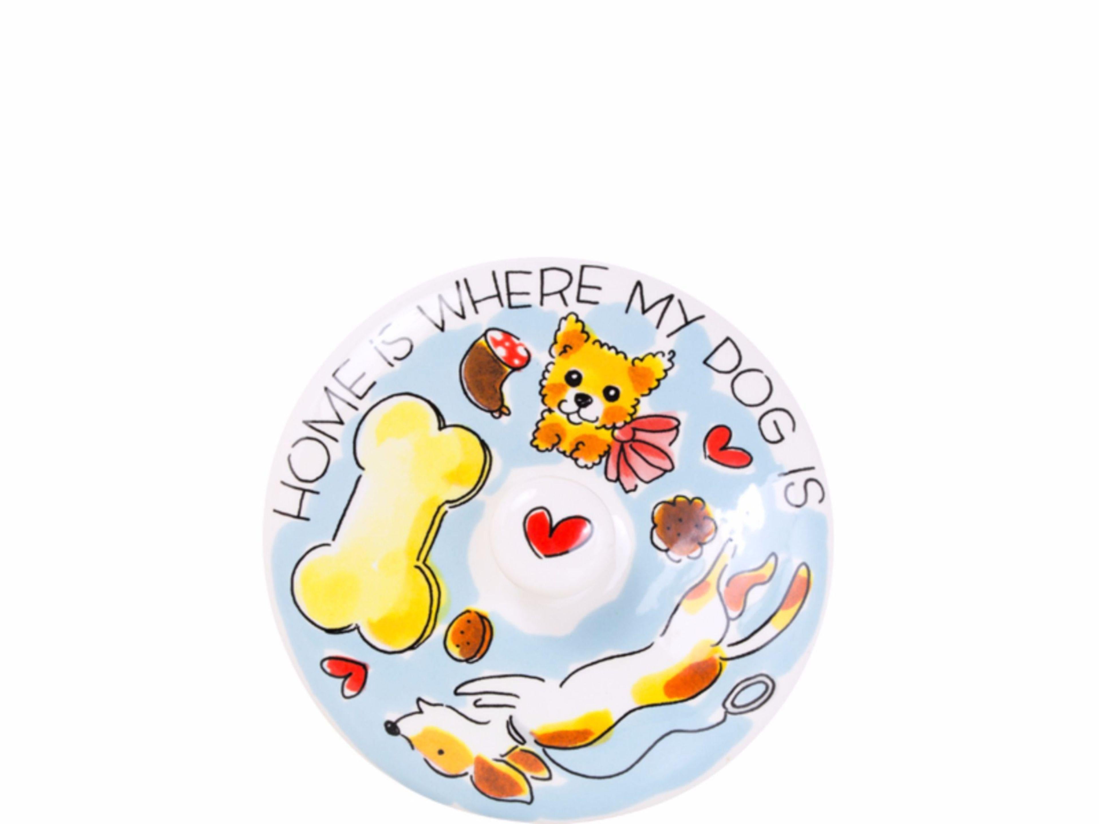 Blond Amsterdam deksel van bovenaf met bot, hondjes en tekst 'Home is where my dog is'.
