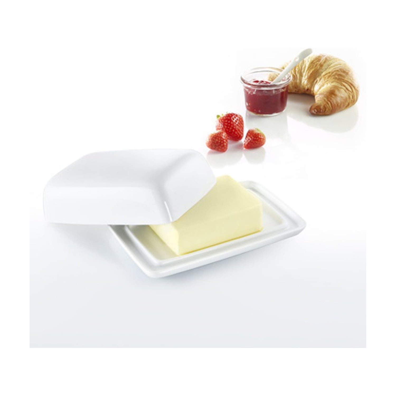 Westmark Botervloot, wit aardewerk, geopend met een blok boter, croissant en jam op tafel