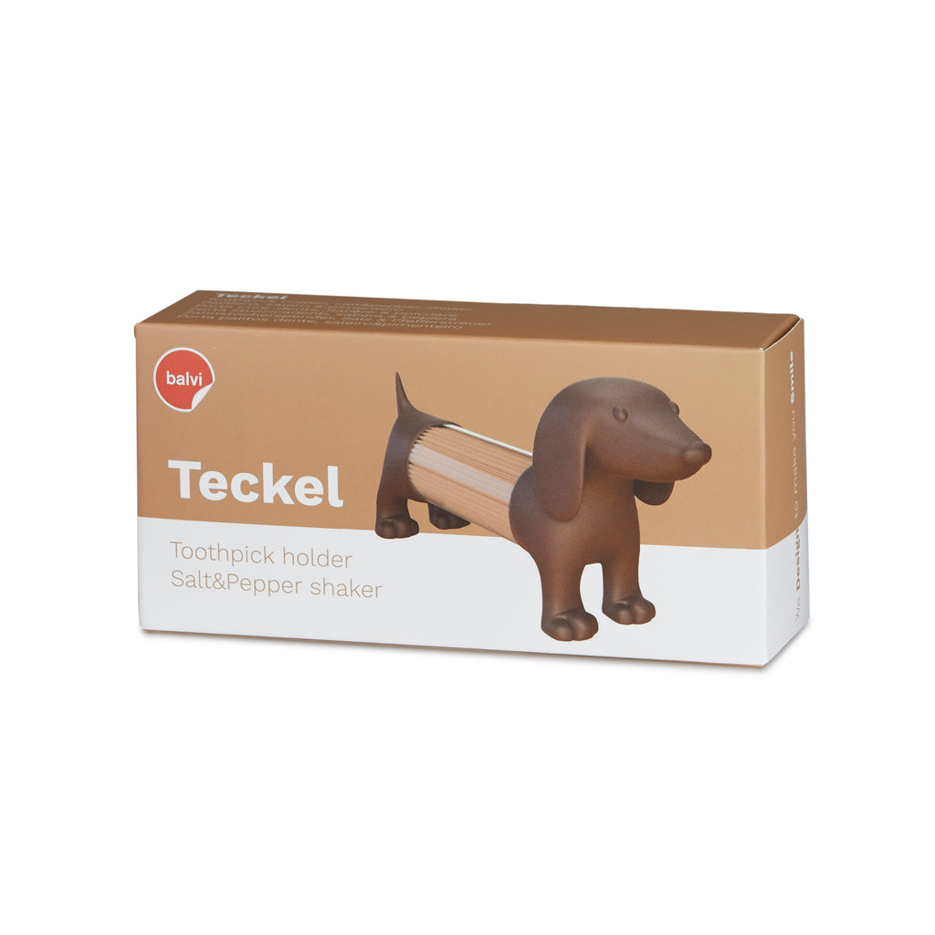Beige verpakkingsdoos met de tekst Teckel, toothpick holder en salt & pepper shaker, en een bruine teckel met tandenstokers