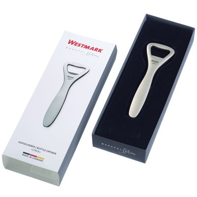 Westmark Linea Flesopener, zandkleurig, gesloten witte doos met productfoto naast de geopende donkere geschenkverpakking met de opener erin