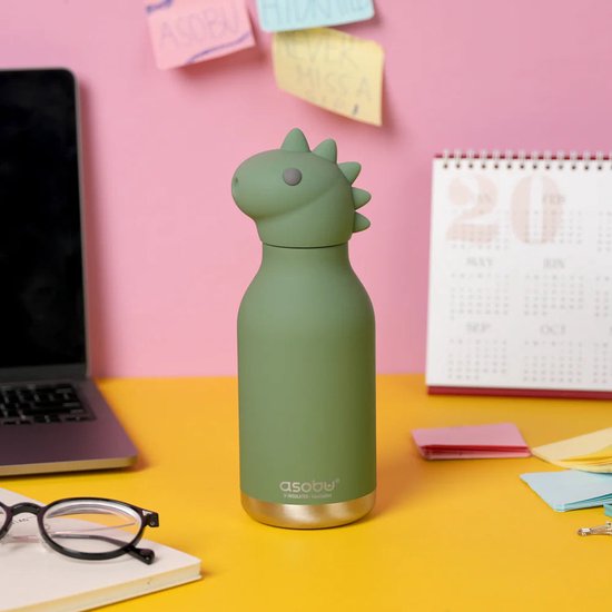 Asobu Bestie Thermosfles Dinosaurus op een bureau tussen laptop en agenda