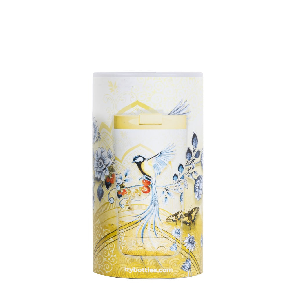 Verpakking van de IZY Thermosbeker Saffron Gold met vogel- en bloemenprint