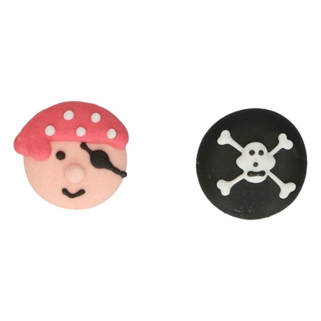 Suikerdecoraties van een piratenhoofd en een doodskop met gekruiste beenderen