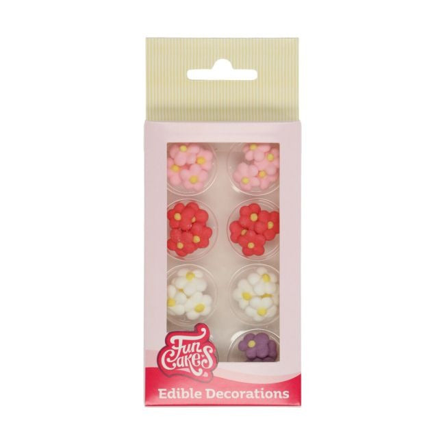 Verpakking met suikerbloemen in roze, rood, wit en paars