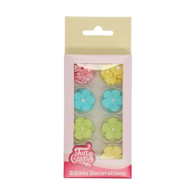 Verpakking met suikerbloemen in roze, geel, blauw en groen