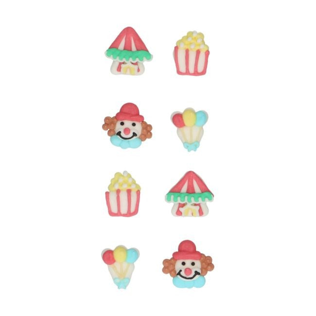 Suikerdecoraties met kermisthema zoals een clown, popcorn en ballonnen