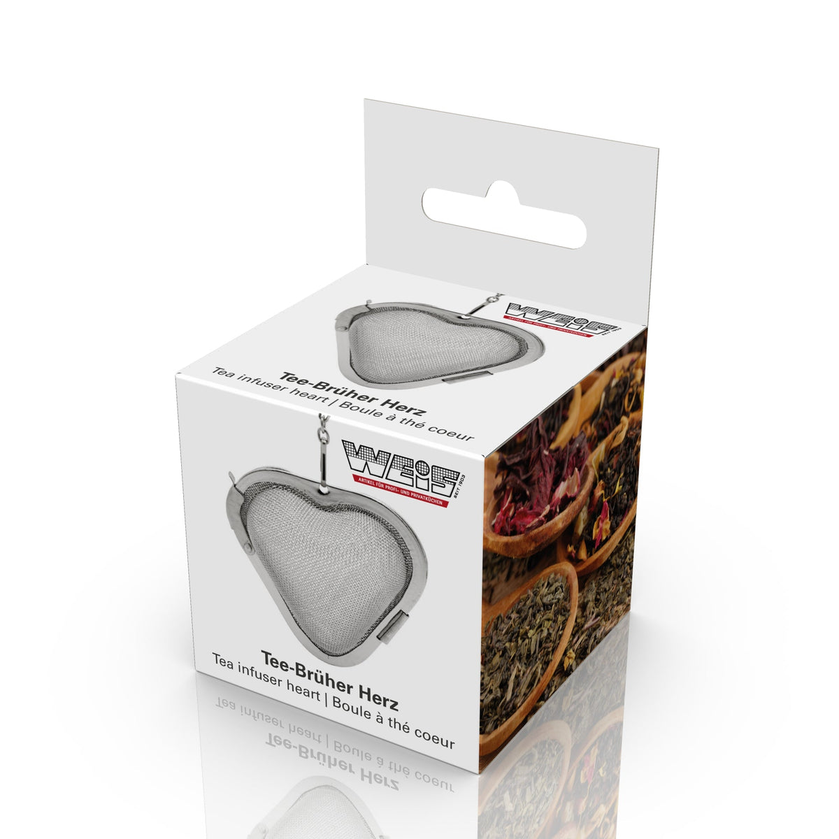 Weis-doos met ophangoog en de hartvormige thee-ei aan een ketting, met schaaltjes losse thee op de zijkant