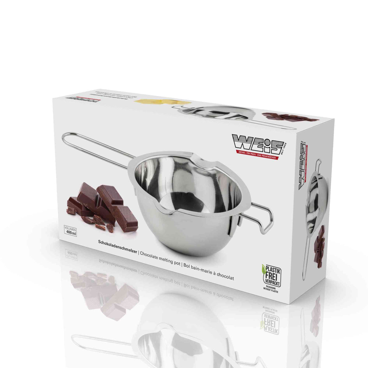 Doos van de chocoladesmelter met Weis-logo, de kom met lange draadsteel en een stapel stukken pure chocolade ernaast